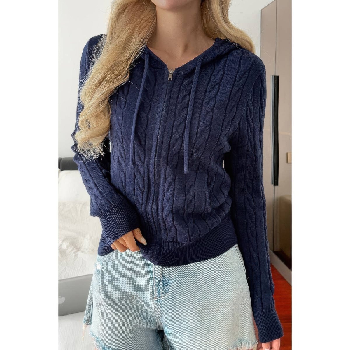Women's cable knit hooded jacket with front pockets, relaxed fit, chunky texture for cozy warmth