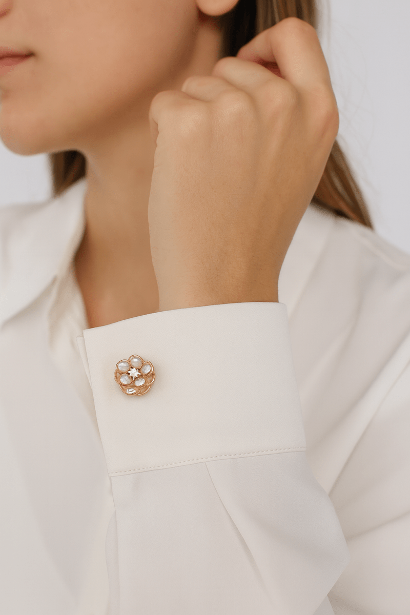 Women's camellia flower cufflinks with polished petals and natural pearl center for elegant professional style