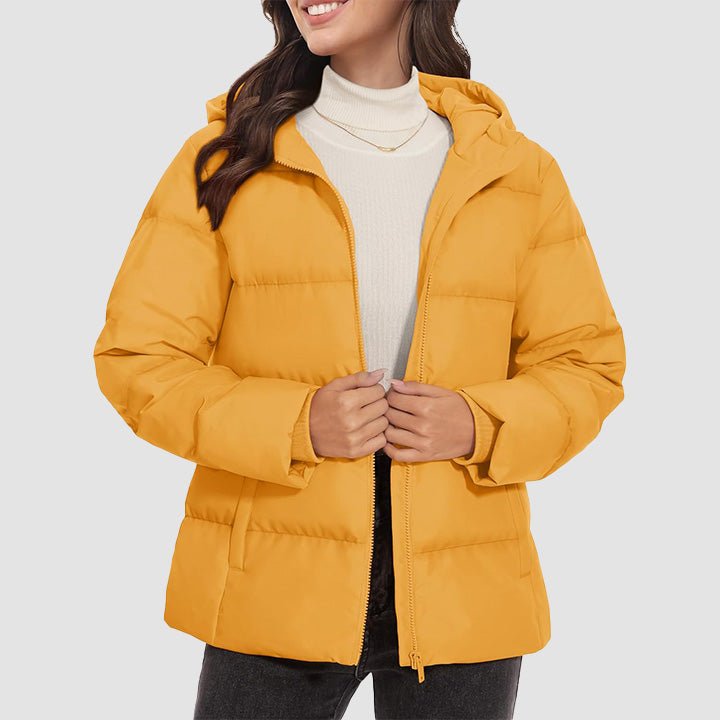 Women's lightweight quilted hooded down jacket in neutral tone with side pockets for winter