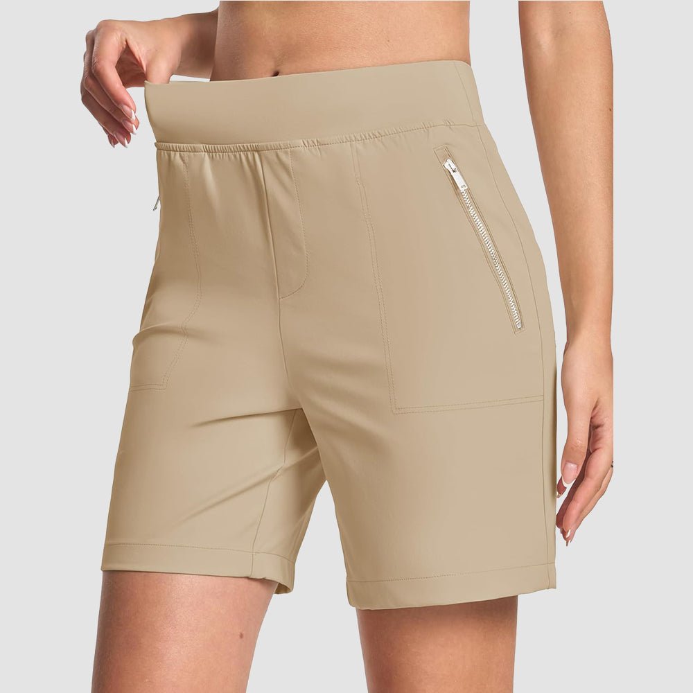 Women's lightweight olive green high-waisted hiking shorts with moisture-wicking fabric and 7-inch inseam