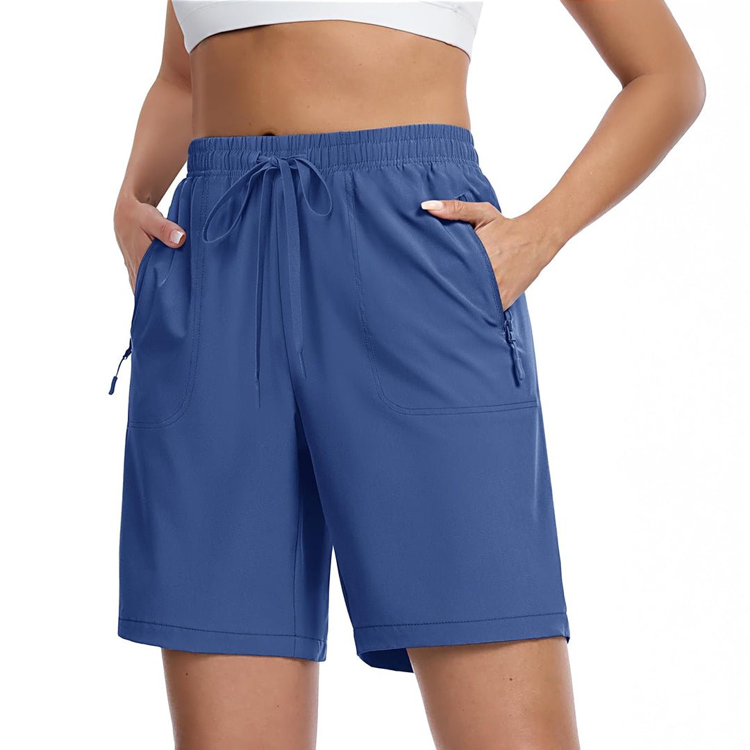 Women's lightweight quick-dry hiking shorts in neutral tone with 8-inch inseam and multi-pocket design