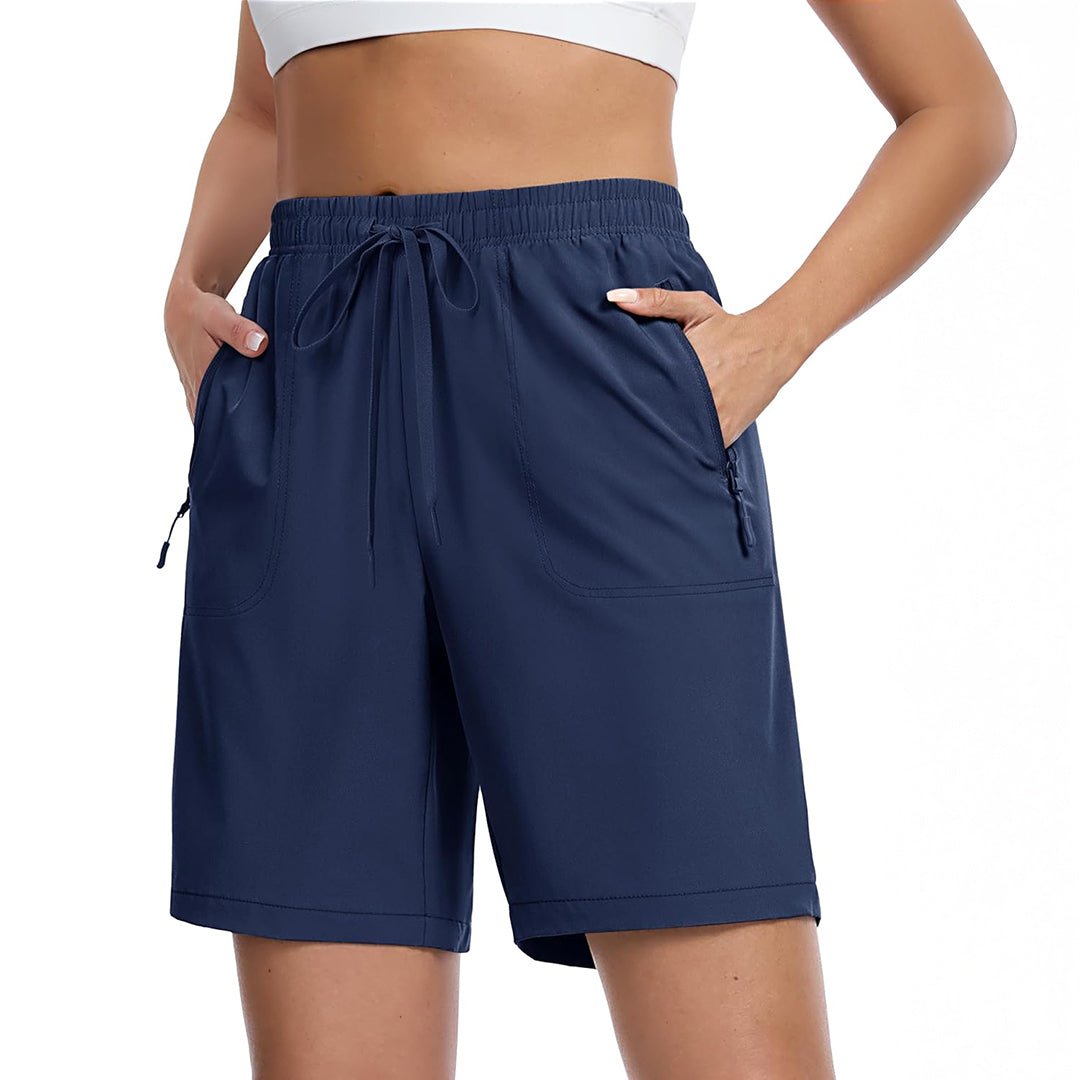 Women's lightweight quick-dry hiking shorts in neutral tone with 8-inch inseam and multi-pocket design