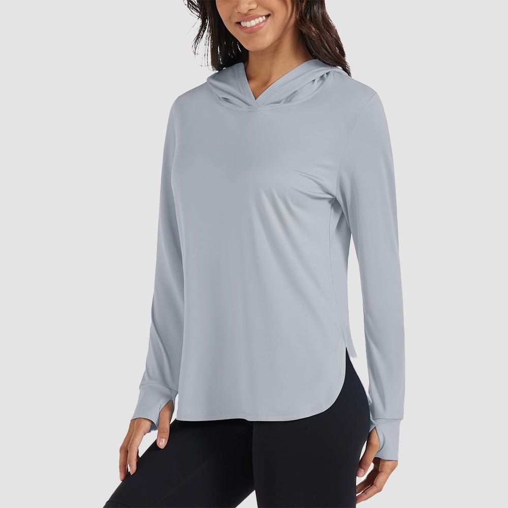Women's lightweight UPF 80+ rashguard hoodie in sun-protective fabric with thumbholes for all-day coverage
