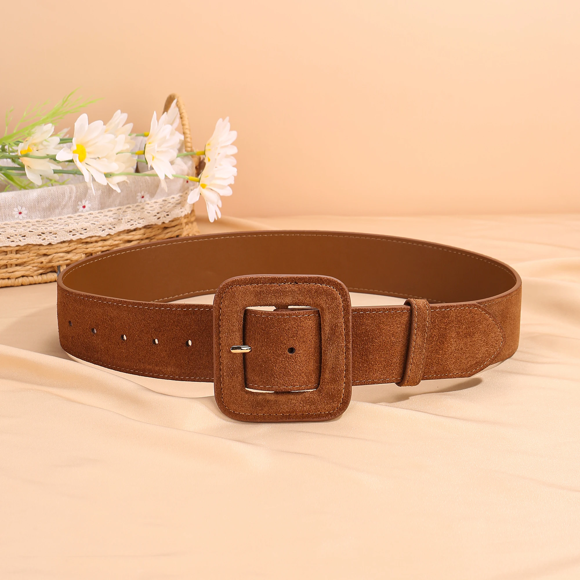 Women's wide brown suede belt with bold square buckle and durable stitching, modern fashion statement