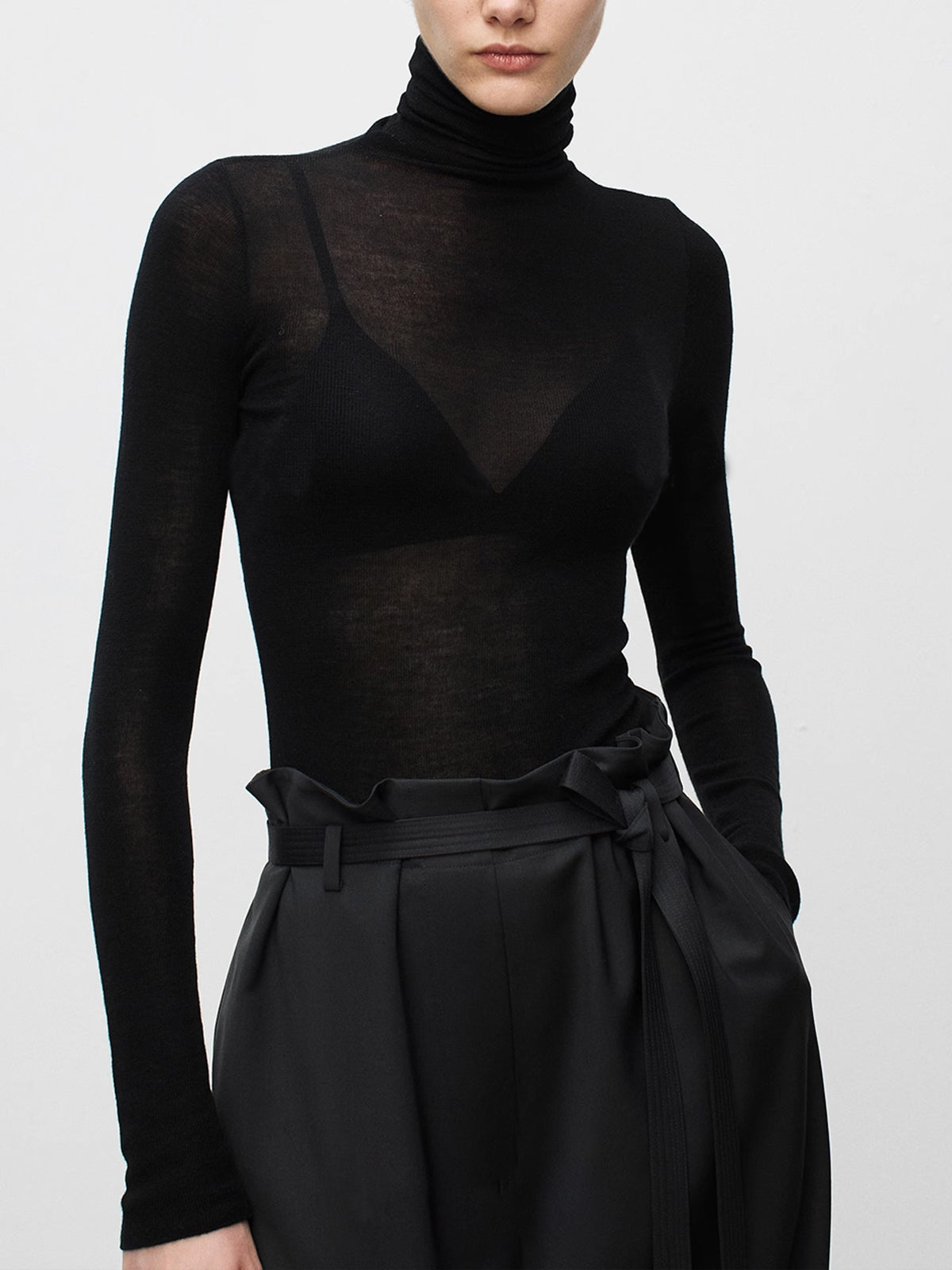 Women's sheer wool-blend turtleneck sweater in romantic knit style with delicate transparent finish