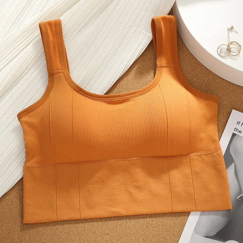 Black seamless longline sports bra with sculpted ribbed fit, full coverage, and zero ride-up for active women