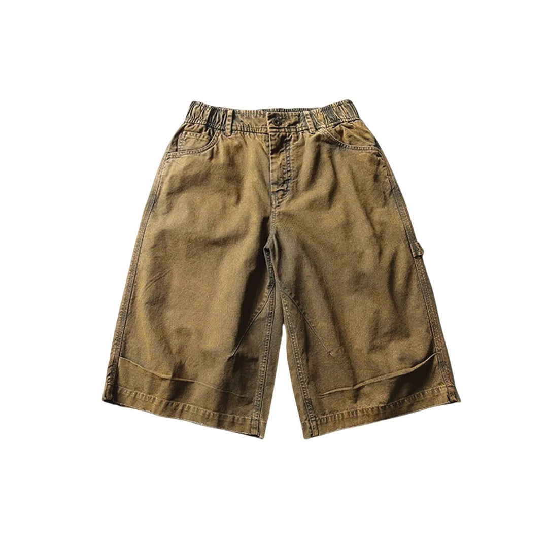 Washed cotton canvas oversize shorts in neutral tones with utility pockets and reinforced hem