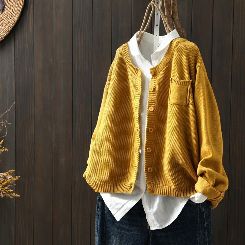 Women's relaxed-fit cozy knit cardigan with button detail, soft neutral tones, layering essential