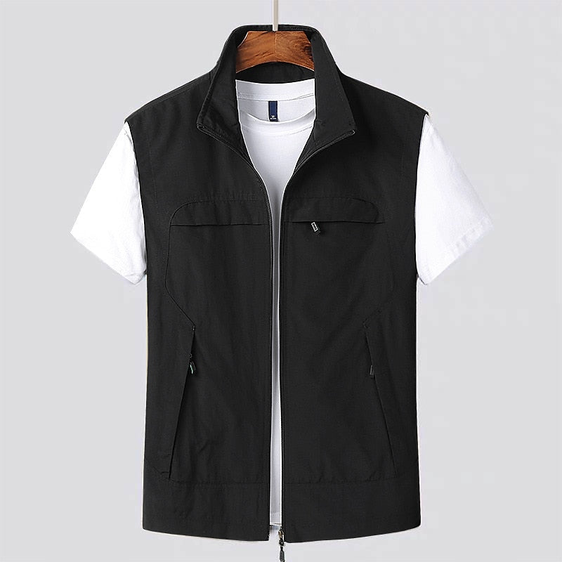 Men's lightweight gray utility vest, sleek minimalist design, multiple pockets, full-zip closure