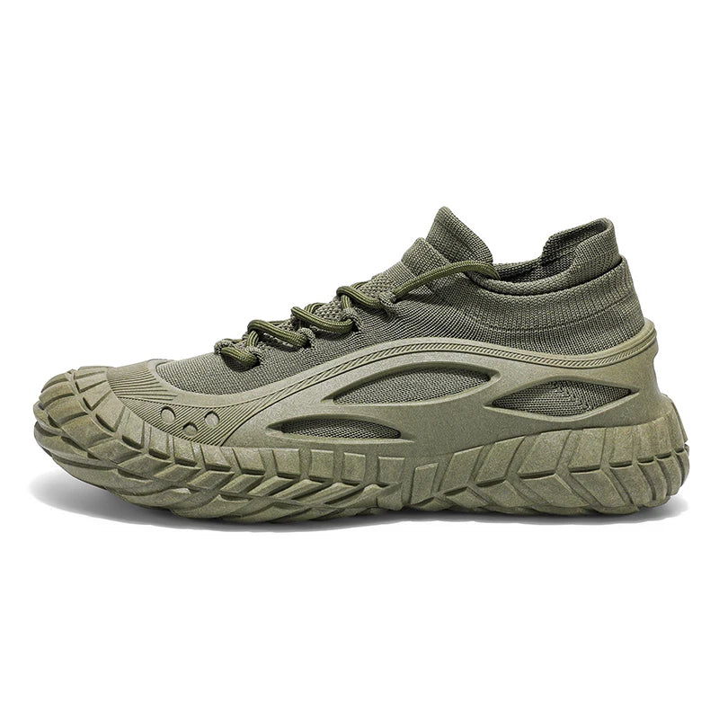 Black urban performance sneaker with tire-grip chunky outsole, breathable exoskeleton, and seamless sock fit