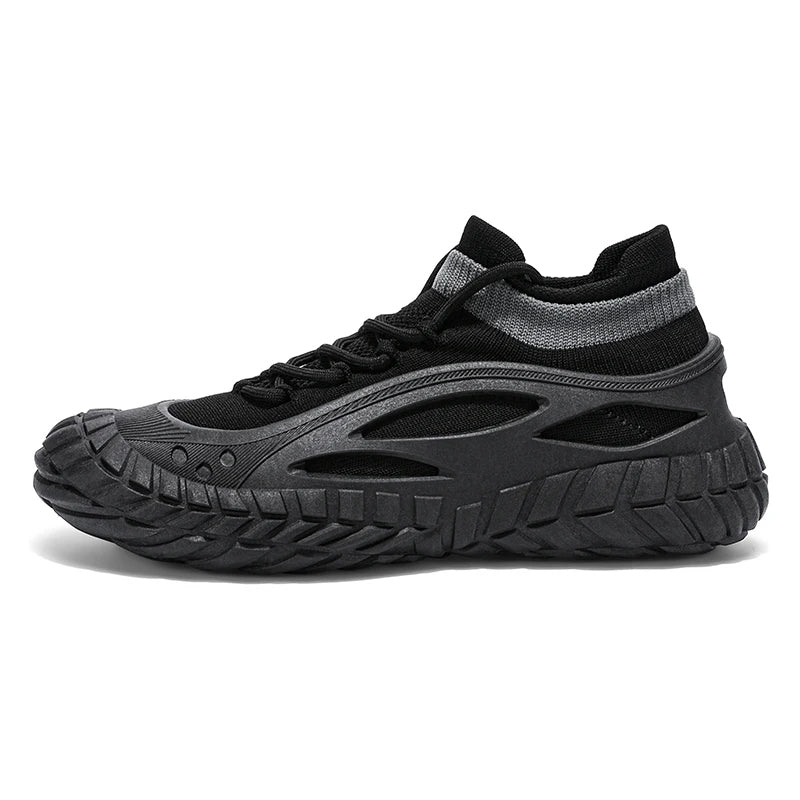 Black urban performance sneaker with tire-pattern chunky outsole, exoskeleton support, and breathable sock fit
