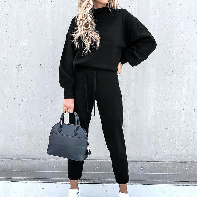 Women's cozy two-piece tracksuit set in neutral tones, relaxed fit with matching joggers