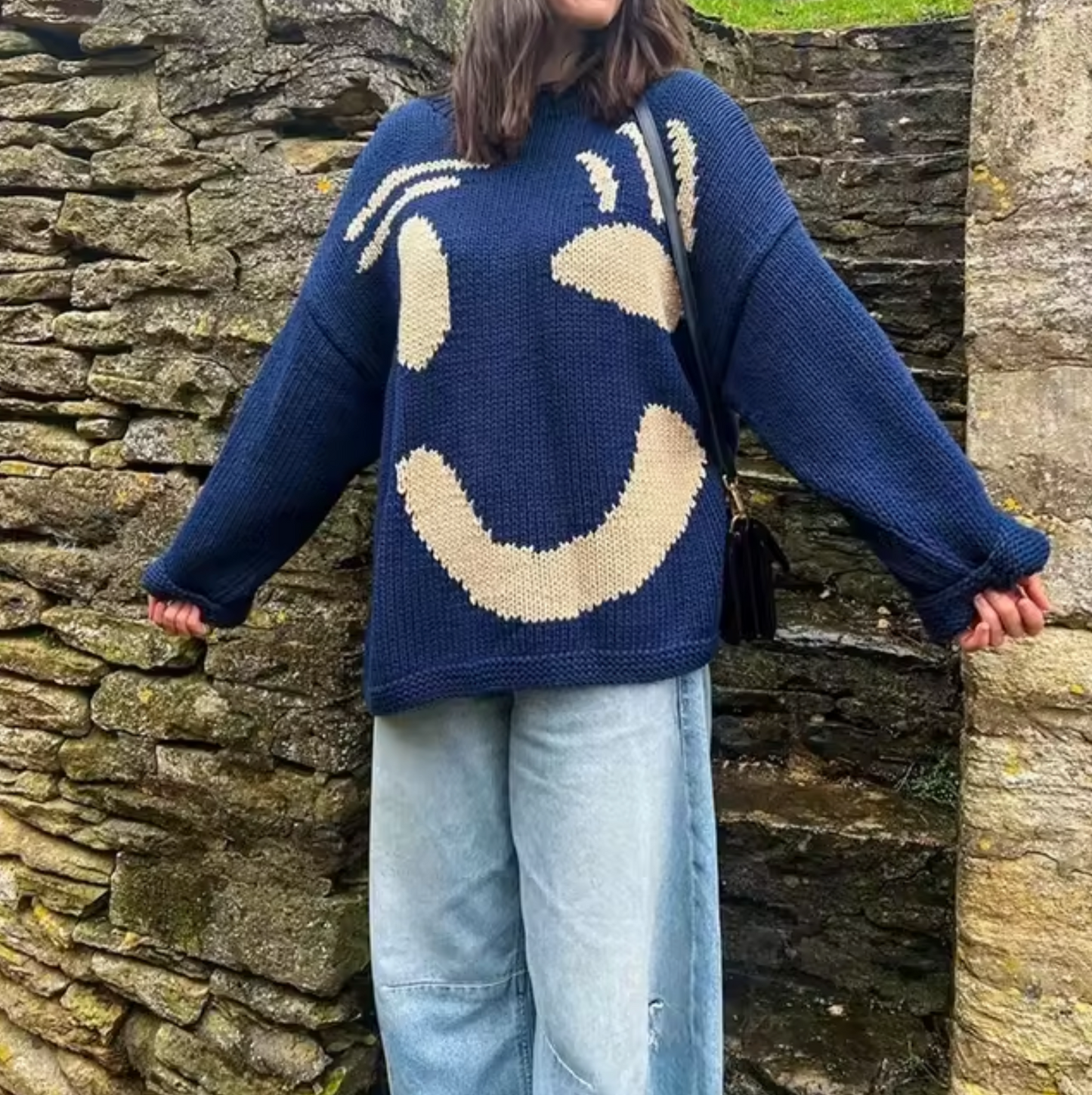 Women's oversized cotton knit sweater in neutral tone, cozy casual fit with relaxed drape